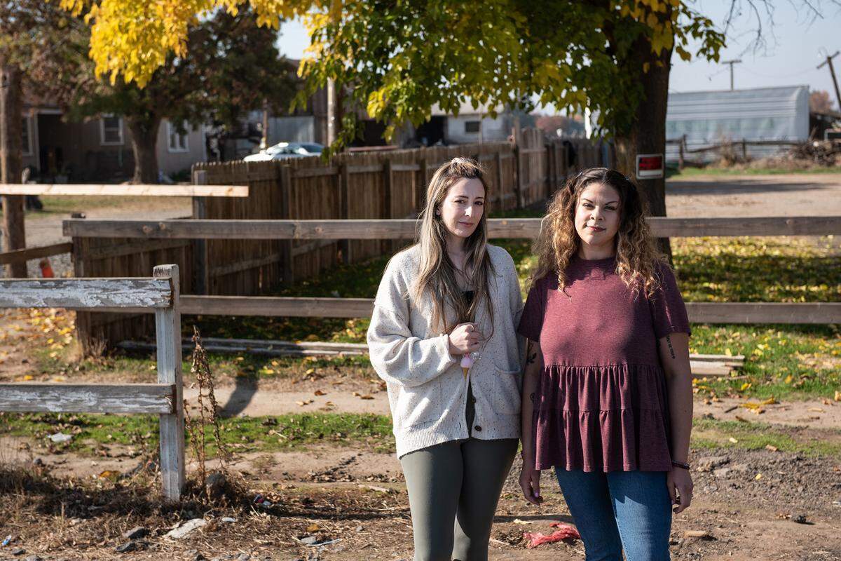 Katie Moody, left, and Franny Hartley on Roselle Avenue in Modesto, Calif., Saturday, Nov. 26, 2022. Moody, Hartley and Franny’s sister, Jocy Davison came to the rescue of a woman in a burning RV on Roselle Avenue.