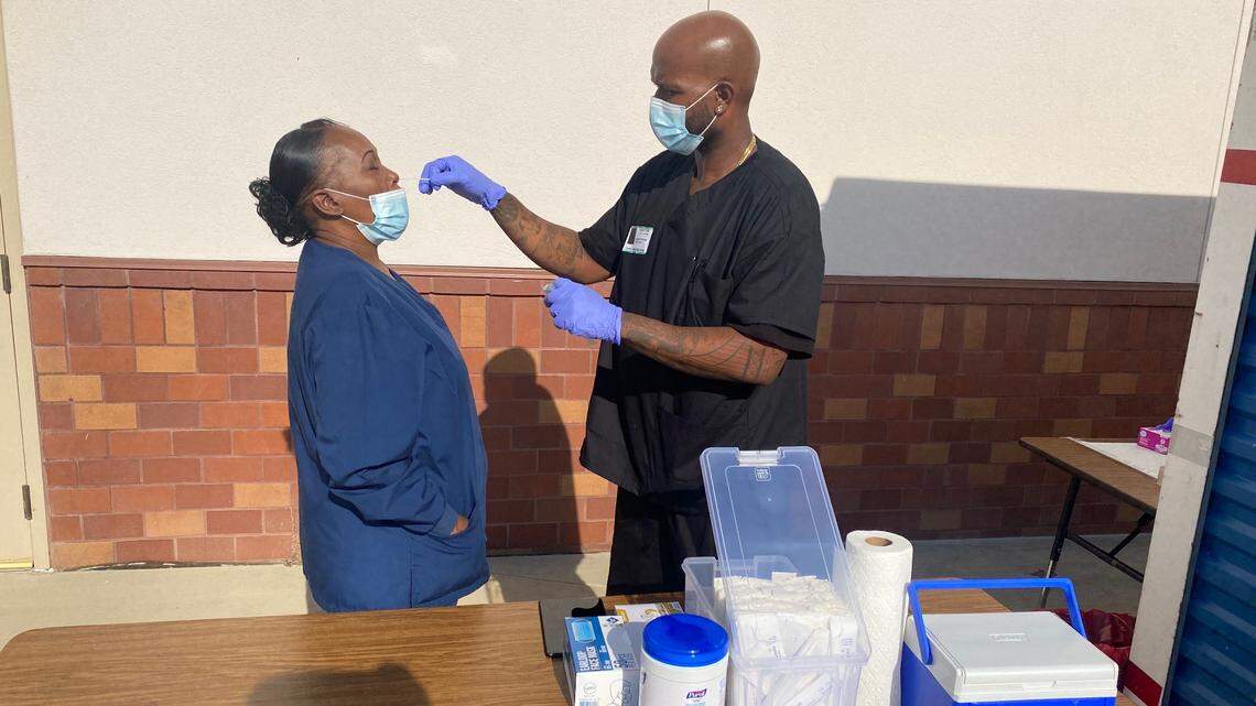 Heal 360 medical assistants administer a COVID-19 test during orientation and training at Central Valley High School.