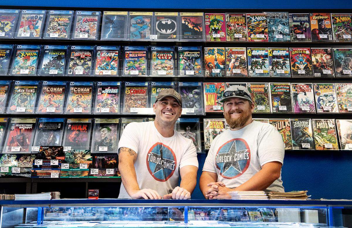 Owners Joey Aiello, left, and Kyle Turner, right, at Turlock Comics in Turlock, Calif., on Wednesday, June, 15, 2022.