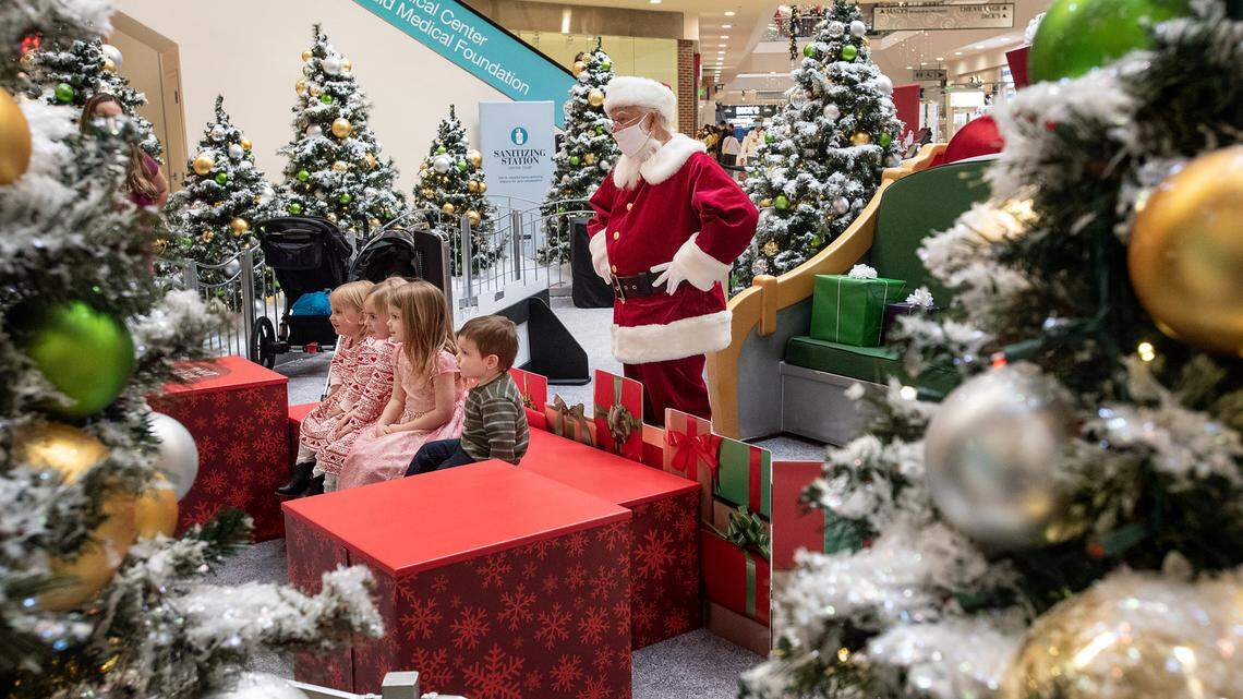 People shop at Vintage Faire Mall in Modesto, Calif., on Friday, Nov. 27, 2020.