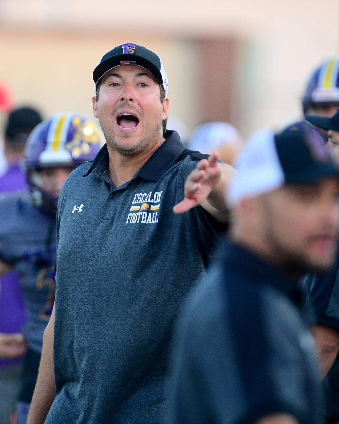 Escalon Head coach Andrew Beam yells to his players on the sideline during a game between Oakdale and Escalon at Oakdale High School in Oakdale, California, on September 15, 2023.