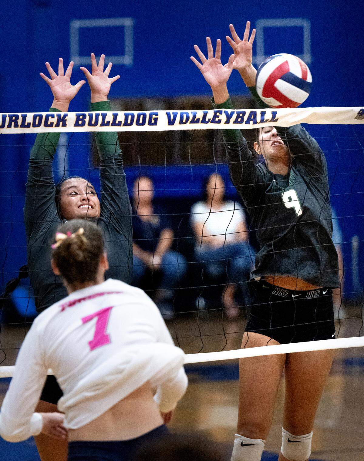 Pitman’s Alyssa Moreno (9) blocks the shot of Amelia Spaulding in the Central California Athletic League match at Turlock High School in Turlock, Calif., Tuesday Oct. 8, 2024.