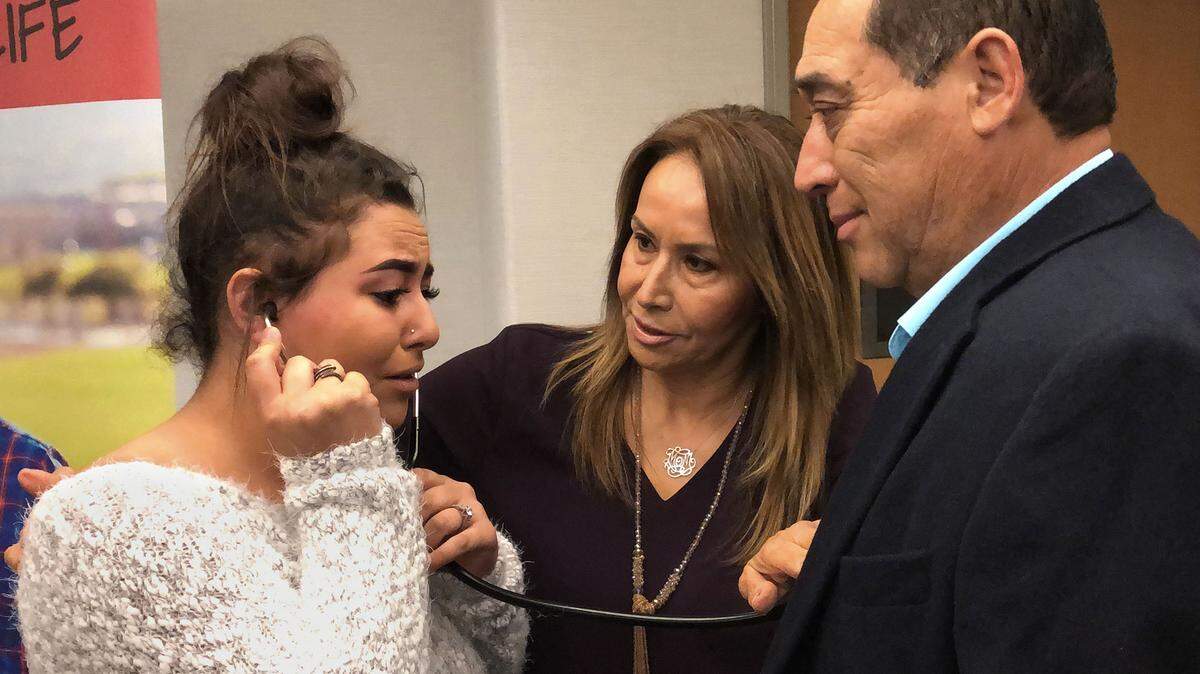 Erika Preciado, 16yrs, of Ceres, Calif. reacts to hearing her father’s heart beat in the chest of Bakersfield resident Ramiro Cruz on Tuesday morning, April 16, 2019, in Modesto.