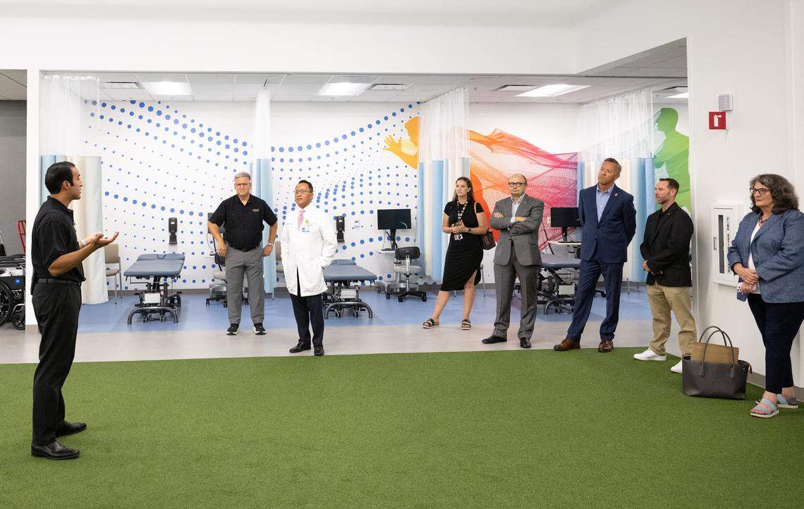 Physician Wais Arsala talks to guests during an open house at the new Kaiser Permanente Sports Medicine Center in Salida, Friday, Aug. 8, 2025.
