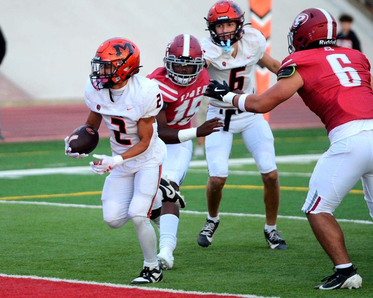 Merced running back Adarias Morales-Saetern (2) scores a touchdown during a game between Patterson High School and Merced High School at Patterson High on Aug. 23, 2024.