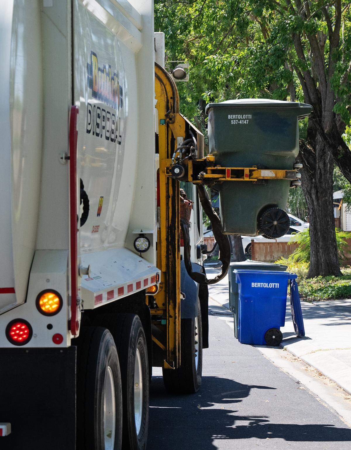 Bertolotti Disposal picks up garbage on Boyce Lane in Modesto, Calif., Friday, August 4, 2023. 