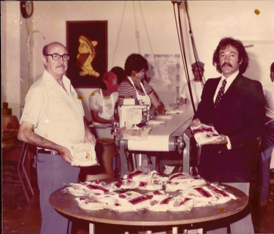 Art Campos (left) and Stephen Campos holding packages of Campos Foods tortillas in 1979.