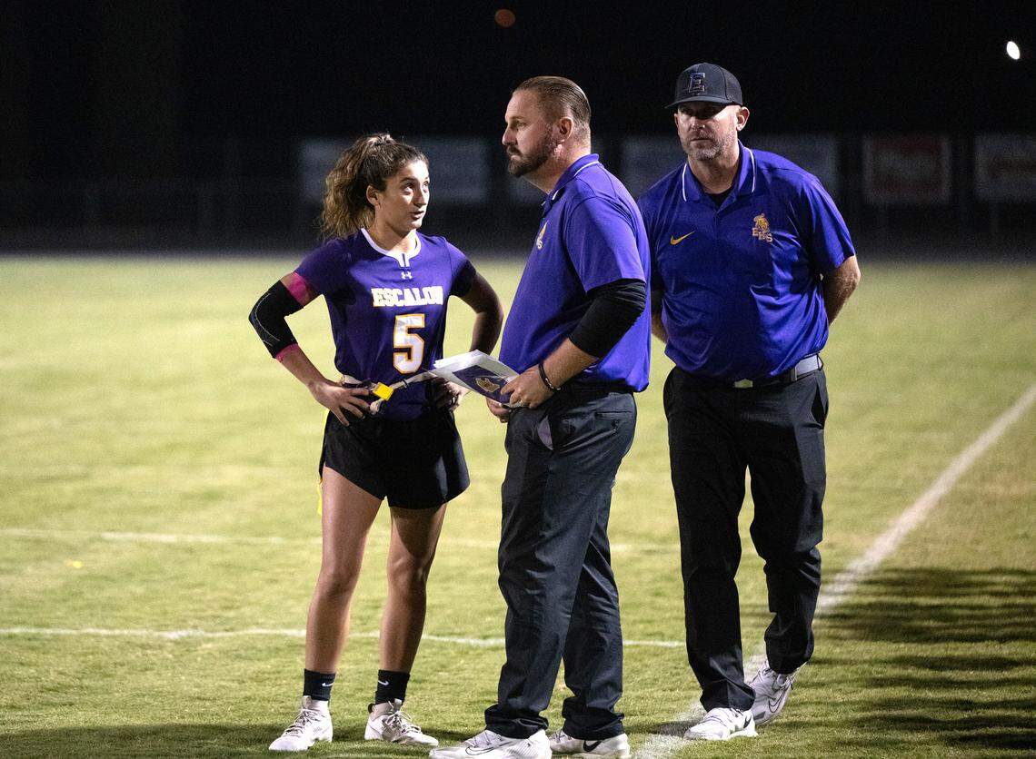 Escalon quarterback Sammy Lang talks with coach Steve Largent on the sideline duirng the CIF Sac-Joaquin Section Division II semifinal playoff game with St. Mary’s in Escalon, Calif., Wednesday, Nov. 1, 2023. St. Mary’s won the game 12-6.