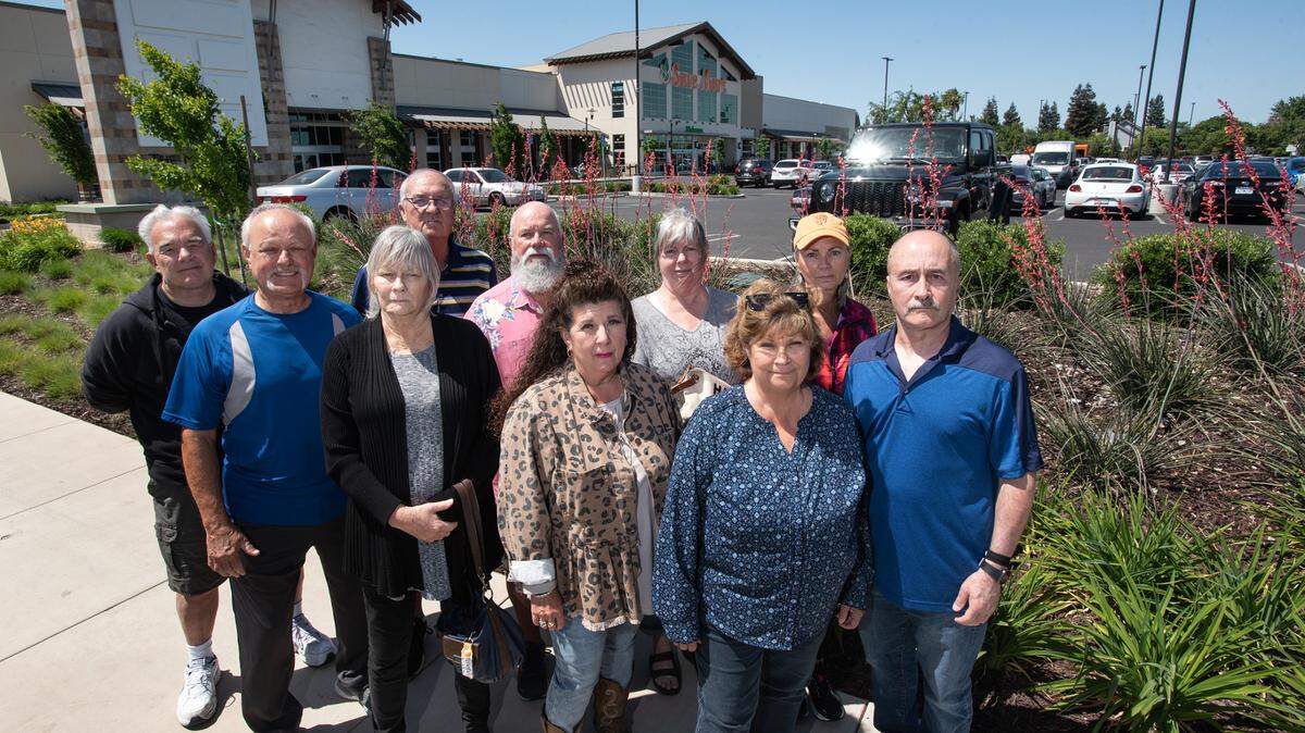 Retired Save Mart companies workers (front row, left to right) Ron Van Hagen, Gary Rector, Julie Di Francia, Laurene Martinez, Vickie Del Re and Larry Rotelli (back row, left to right) Steve Beaver, Ed Corvelo, Toni Koch and Donna McCullough outside the new Save Mart supermarket on Oakdale Road in Modesto, Calif., on Tuesday, May 3, 2022. Hundreds of Save Mart companies retired workers who received a letter from the company stating they will no longer fund the retiree benefit program.