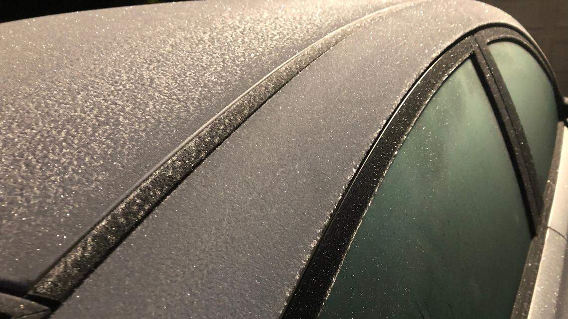 Frost sparkles on a car -- but may be against the law to leave your car running unattended on cold mornings to warm it up. It depends on where you live in NC.