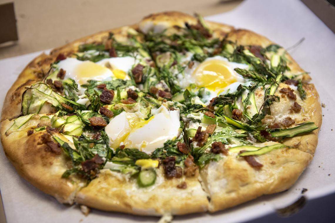Special pizza of the day: asparagus, bacon, egg, arugula, roasted garlic with alfredo sauce, at Stuart’s Pizza on 10th Street in Modesto, Calif., on Tuesday, May 26, 2020.