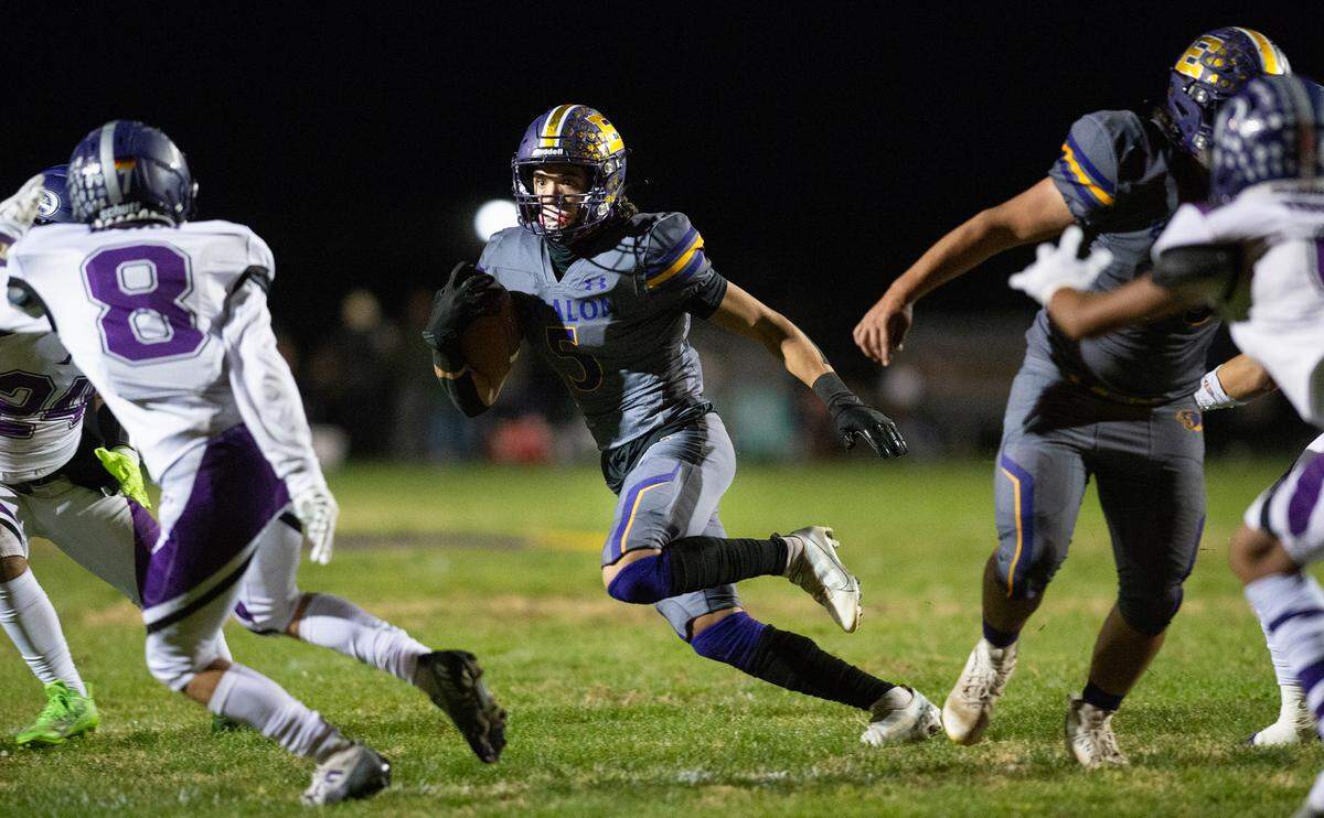 Escalon’s Logan Anderson runs the ball during the first round playoff game with Pacheco in Escalon, Calif., Friday, Nov. 4, 2022. Escalon won the game 55-0.
