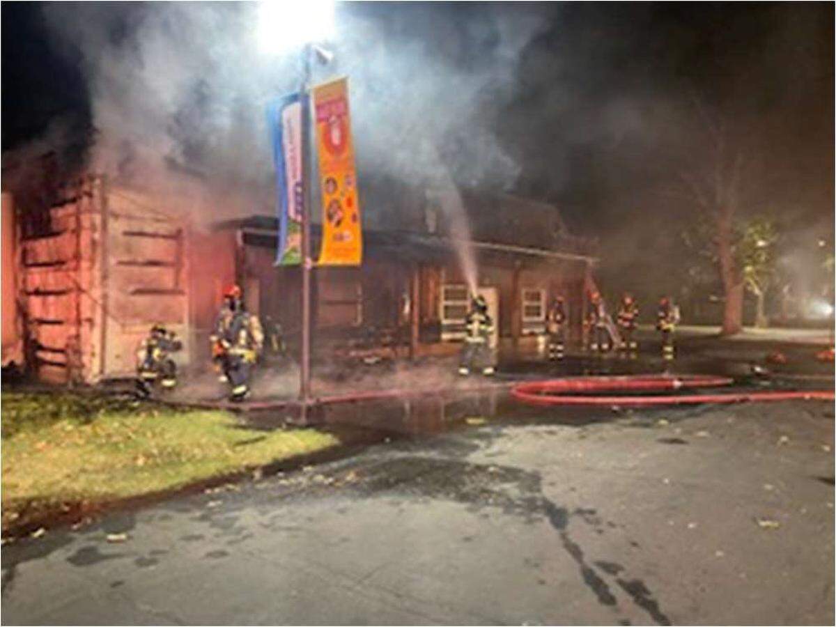 Modesto and Turlock fire departments work on a blaze in one of the structures at the Turlock Fairgrounds.