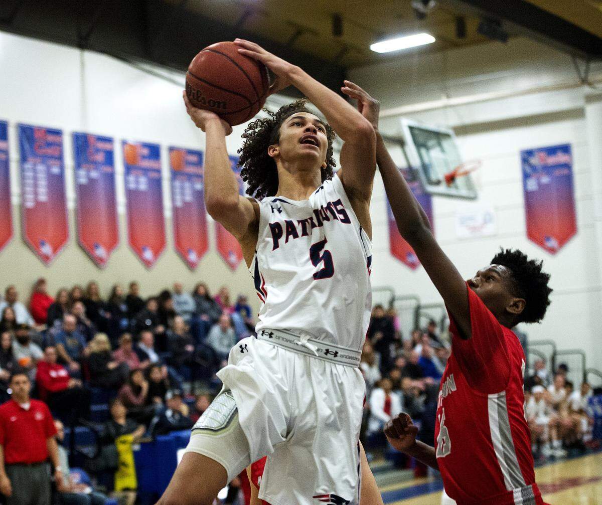 Beyer's Brandon Gray scores during the Sac-Joaquin Section Division II playoff game with Patterson at Beyer High School in Modesto, Calif., on Wednesday, Feb. 22, 2017. Beyer won the game 83-60.
