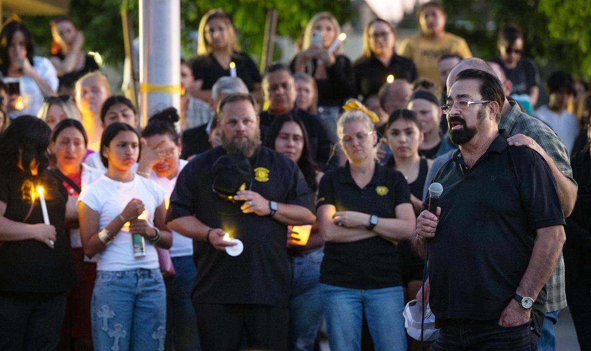 Reyes Madrigal, right, speaks about his daughter Dinella Madrigal during a candlelight ceremony in Hughson, Tuesday, May 6, 2025. Dinella Madrigal died in what is being investigated as a murder-suicide after she and her deputy husband were found dead in their Hughson home.