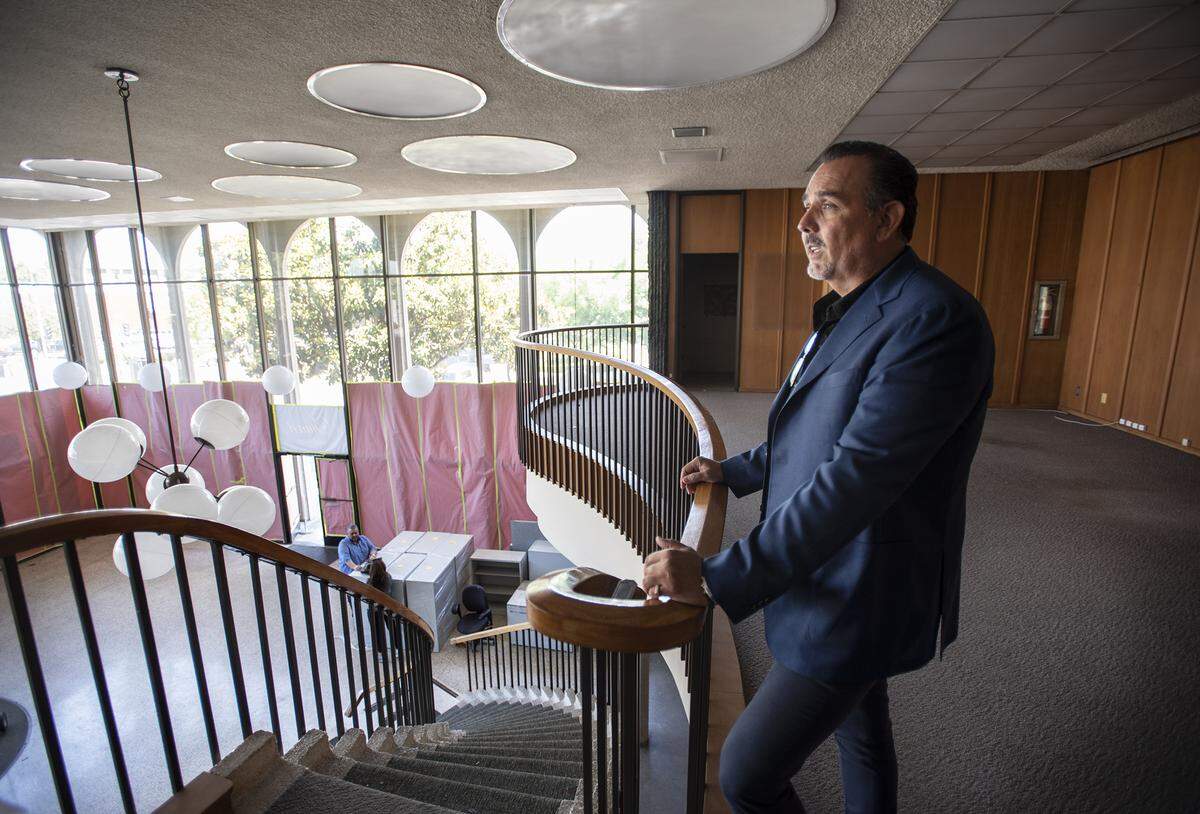 Owner Jaime Jimenez looks out over the former bank property where his planning to start a steakhouse in downtown Modesto at Tenth and I Streets in Modesto, Calif., Friday, May 3, 2019.