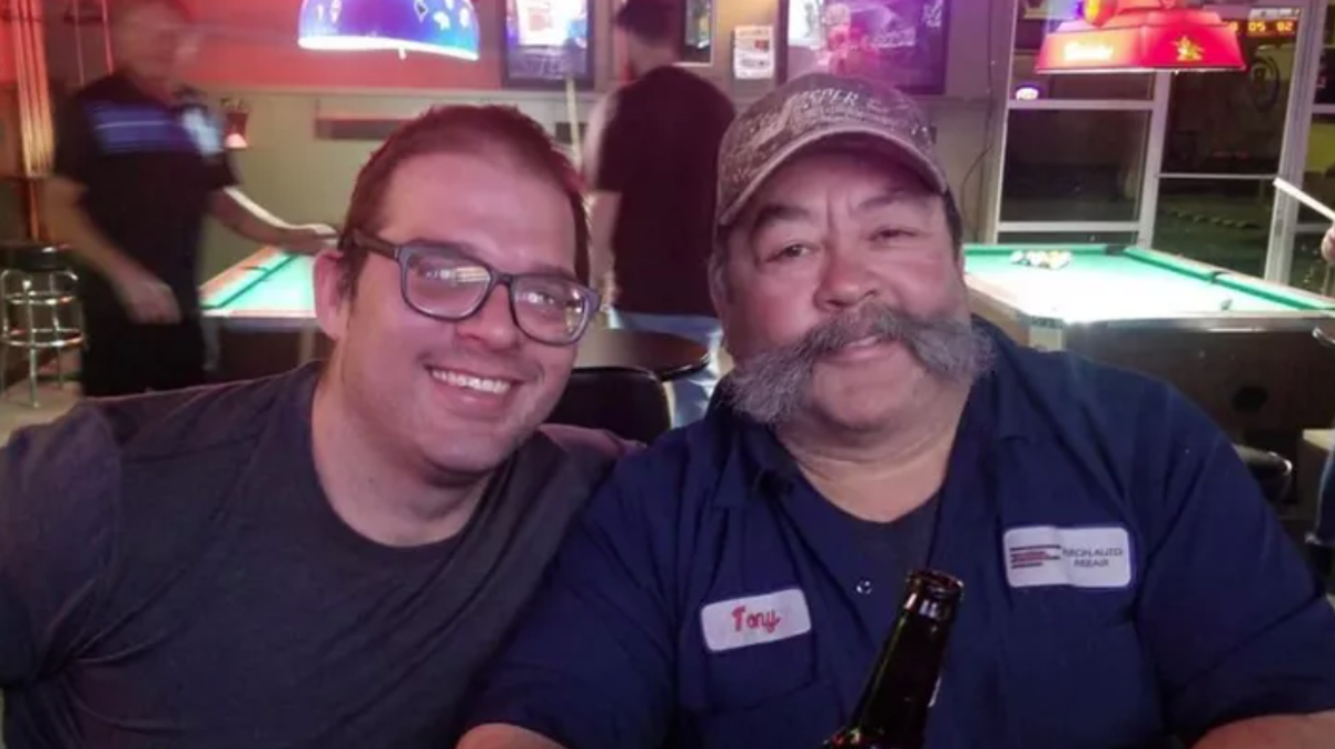 Tony Franco, right, with of his sons.