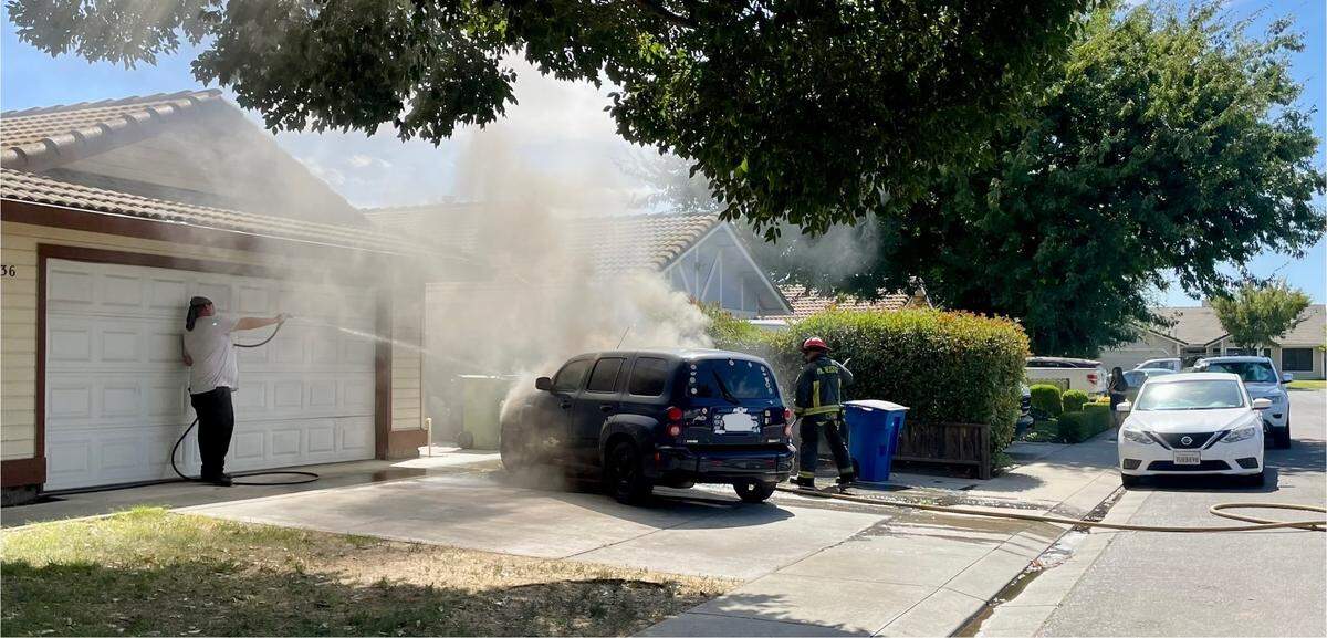 An SUV on fire in a Ceres driveway on Tuesday, July 29, 2025.