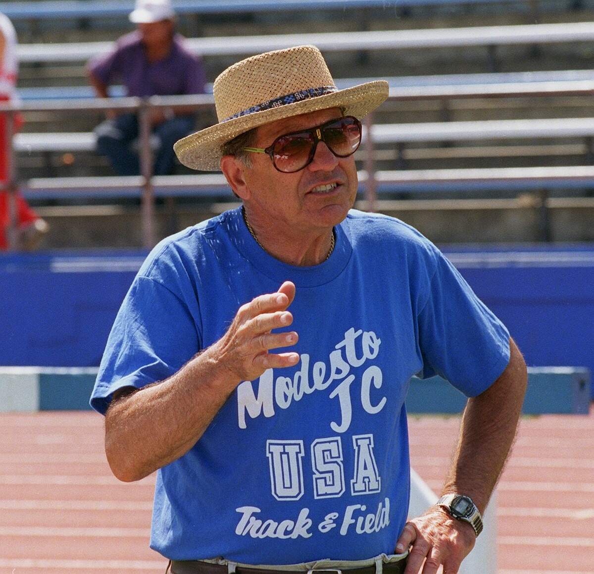 Modesto Junior College coach Jack Albiani argues a point during a protest Saturday at Modesto Junior College stadium. - track and field - track meet