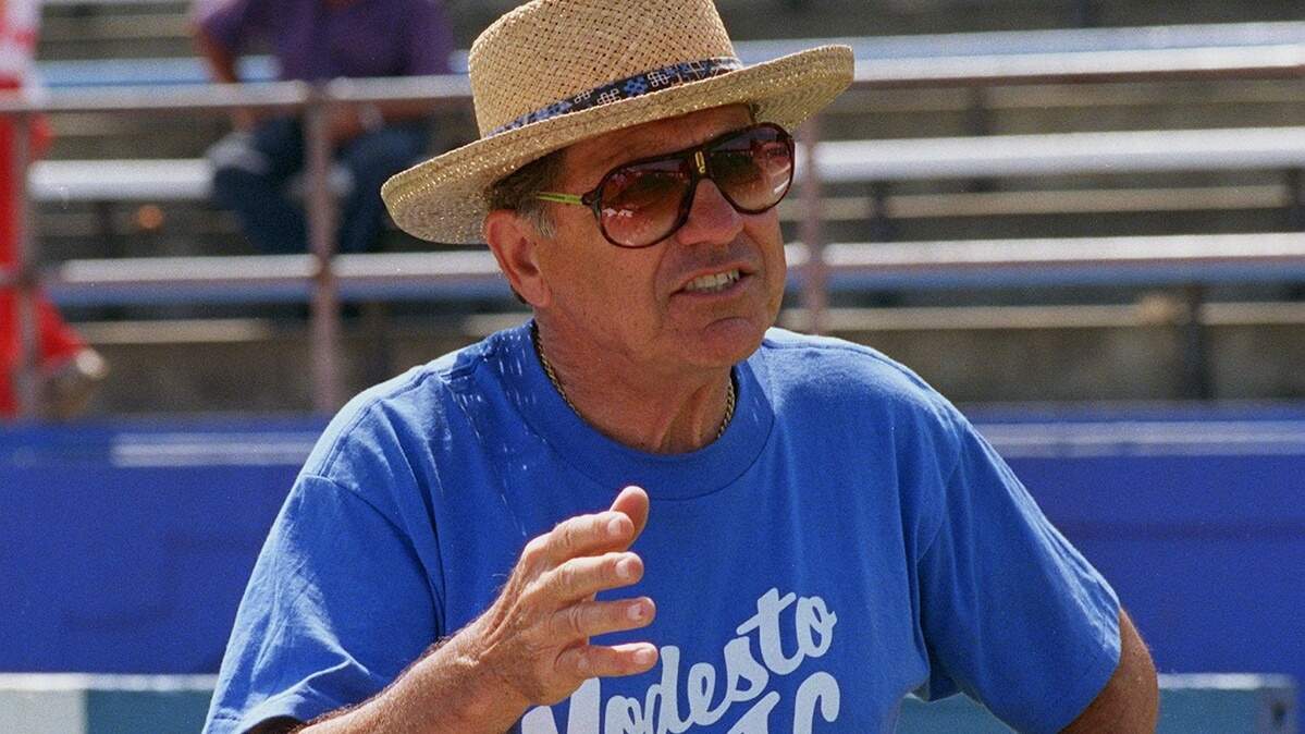 Modesto Junior College coach Jack Albiani argues a point during a protest Saturday at Modesto Junior College stadium. - track and field - track meet
