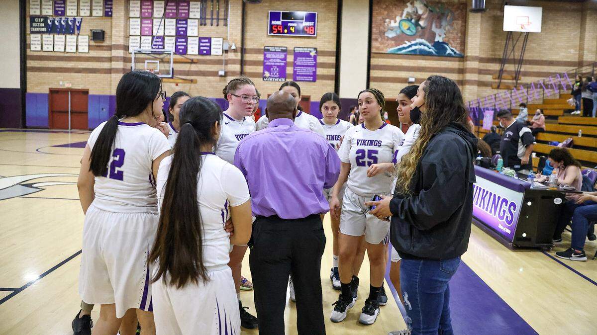 The Johansen girls basketball team huddles during a timeout on Senior Night. The Vikings play in the Sac-Joaquin Section play-in game on Wednesday, Feb. 16.