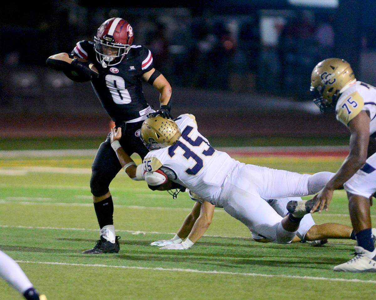 Patterson running back Coby Joseph (8) gets draged down by a Central Catholic defender during a game between Central Catholic High School and Patterson High School at Patterson High School in Patterson California on September 9, 2024. Central Catholic won the game 25-14