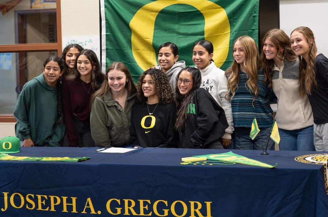 Gregori High soccer player Kylie Farmer takes a picture with teammates after signing with the University of Oregon on Wednesday, Nov. 12, 2025 in Modesto, Calif.