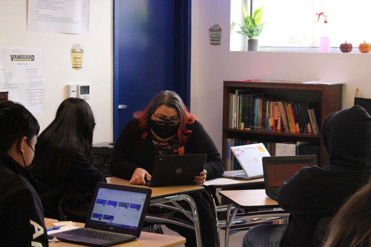 Education specialist Sofia Balderas works with a few students in a 10th grade English class at Aspire Vanguard College Preparatory Academy on Nov. 19. Meanwhile, a general education teacher worked with the rest of the class.