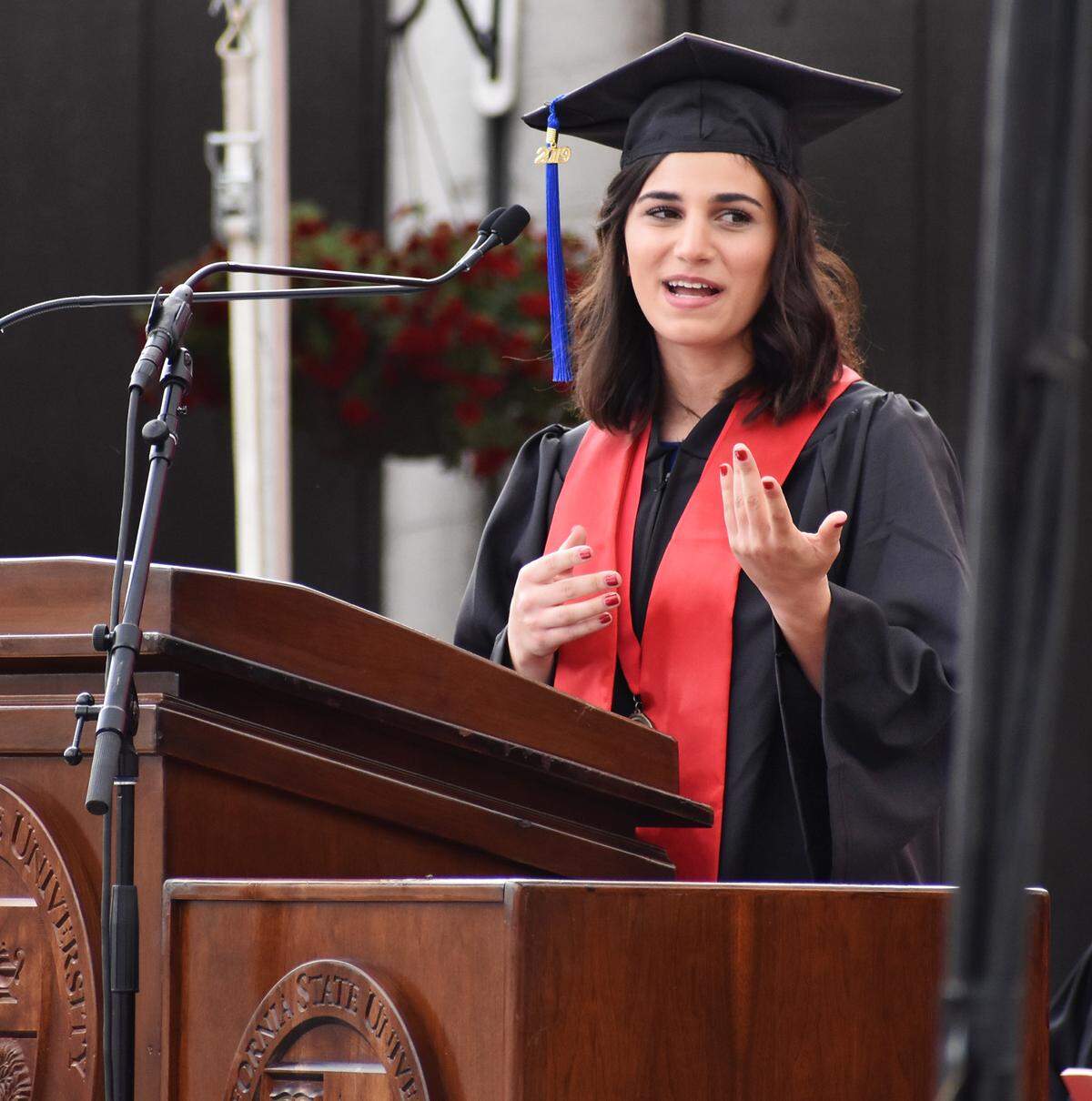 Student speaker Emily Yonan addresses her fellow grads during the California State University, Stanislaus, commencement for the College of the Arts, Humanities and Social Sciences on Thursday morning, May 23, 2019.