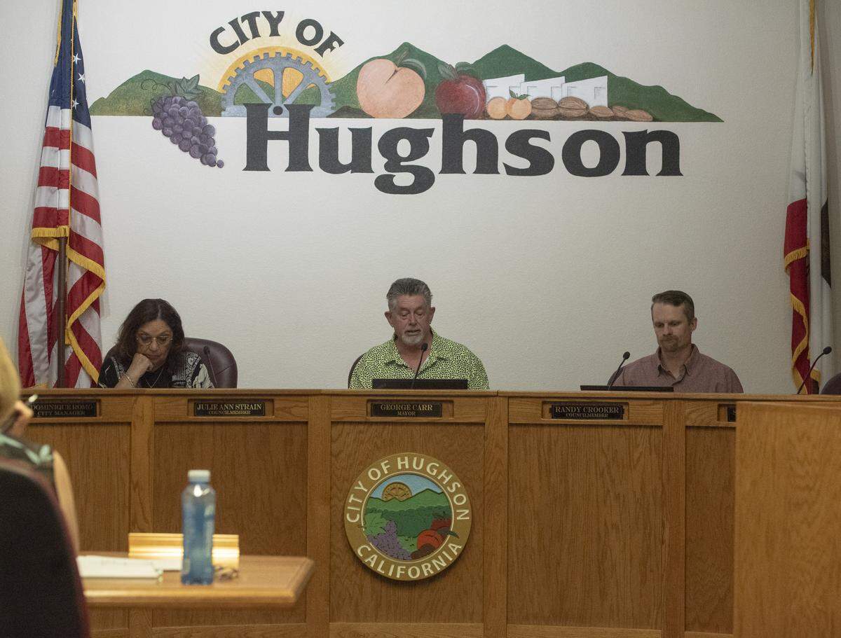 Hughson Mayor George Carr, center, sits alongside council members Julie Ann Strain, left, and Randy Crooker during a Hughson City Council meeting Tuesday, May 26, 2026.
