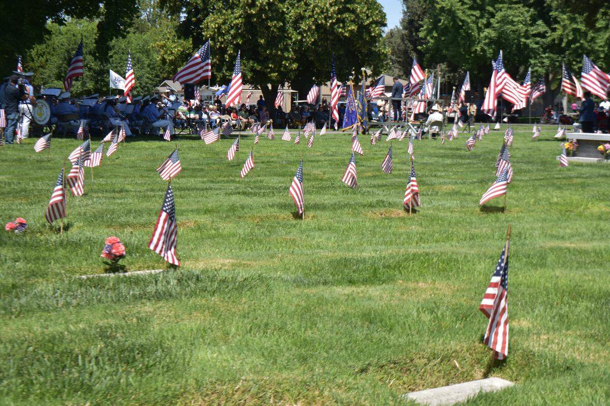 Flags large and small filled parts of Acacia Memorial Park in Modesto on Memorial Day, Monday, May 25.