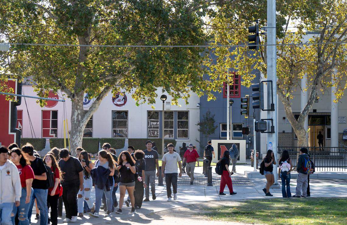 Students cross Paradise Road outside Modesto High School in Modesto, Calif., Tuesday Oct. 8, 2024.