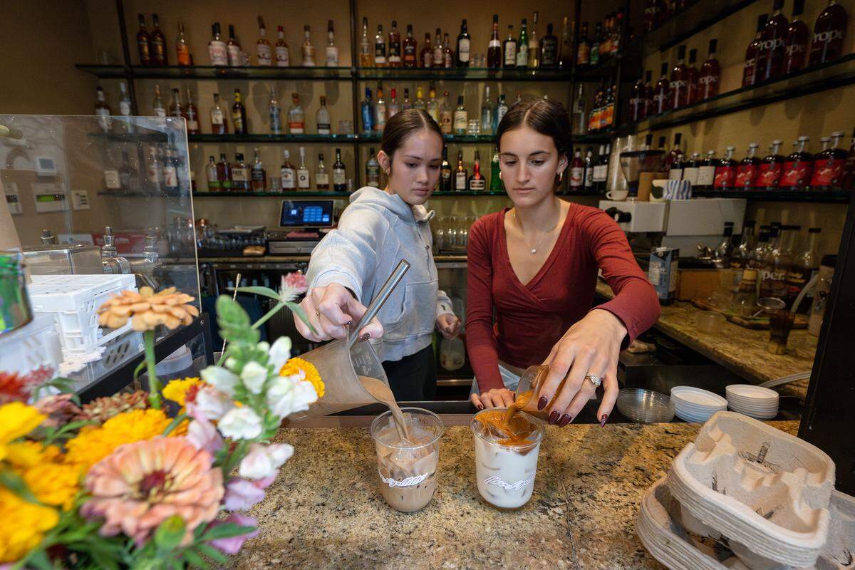 Flora Cafe owner Hannah Souza, right, and her co-worker prepare drinks at Galletto on J Street in Modesto on Nov. 20, 2025
