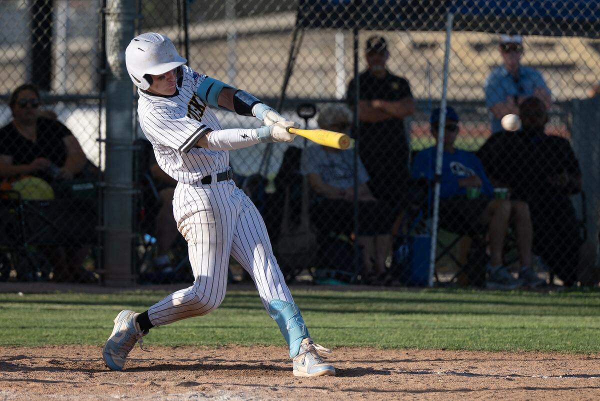 Hughson shortstop Beau Blake drives a two-run double during the Sac-Joaquin Section Division 5 semifinal playoff game with Wheatland at Hughson High School in Hughson, Thursday, May 15, 2025.