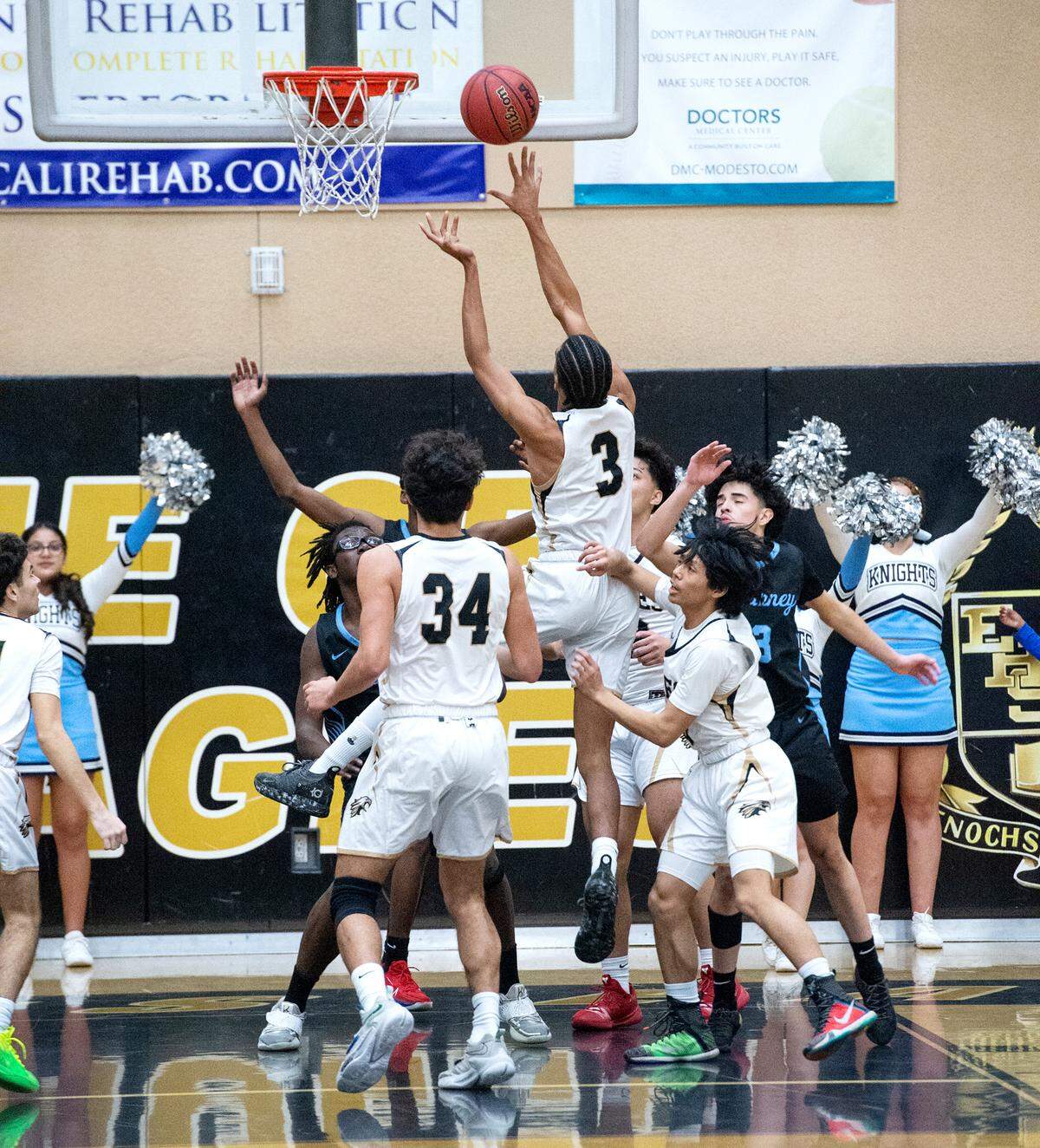 Enochs’ Kevin King scores during the Central California Athletic League game with Downey at Enochs High School in Modesto, Calif., Friday, Jan. 27, 2023. Downey won the game 47-40.