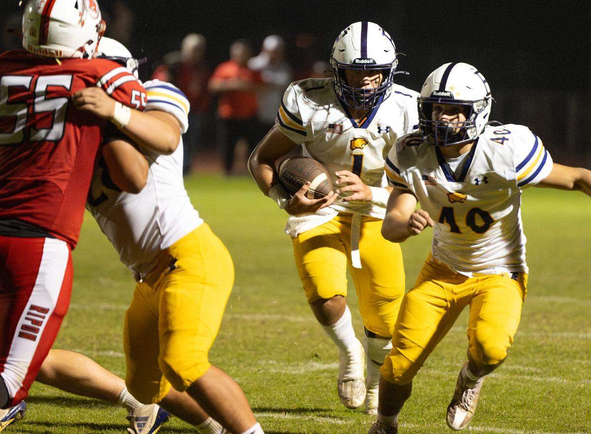Escalon quarterback Logan Huebner breaks toward the end zone during the Trans-Valley League game with Ripon at Ripon High School in Ripon, Friday, Oct. 25, 2024.