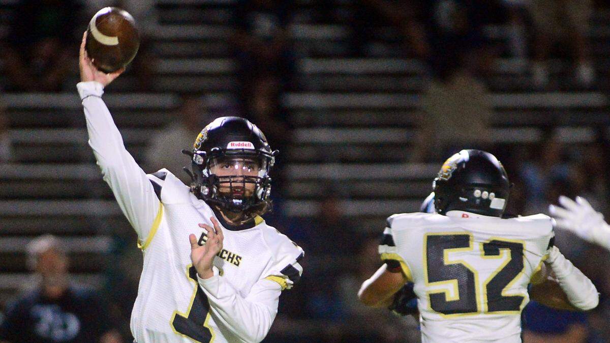 Enochs quarterback Adam Ammar thows screen pass during a game between Downey High School and Enochs High School at Downey High School in Modesto CA on October 13, 2022.