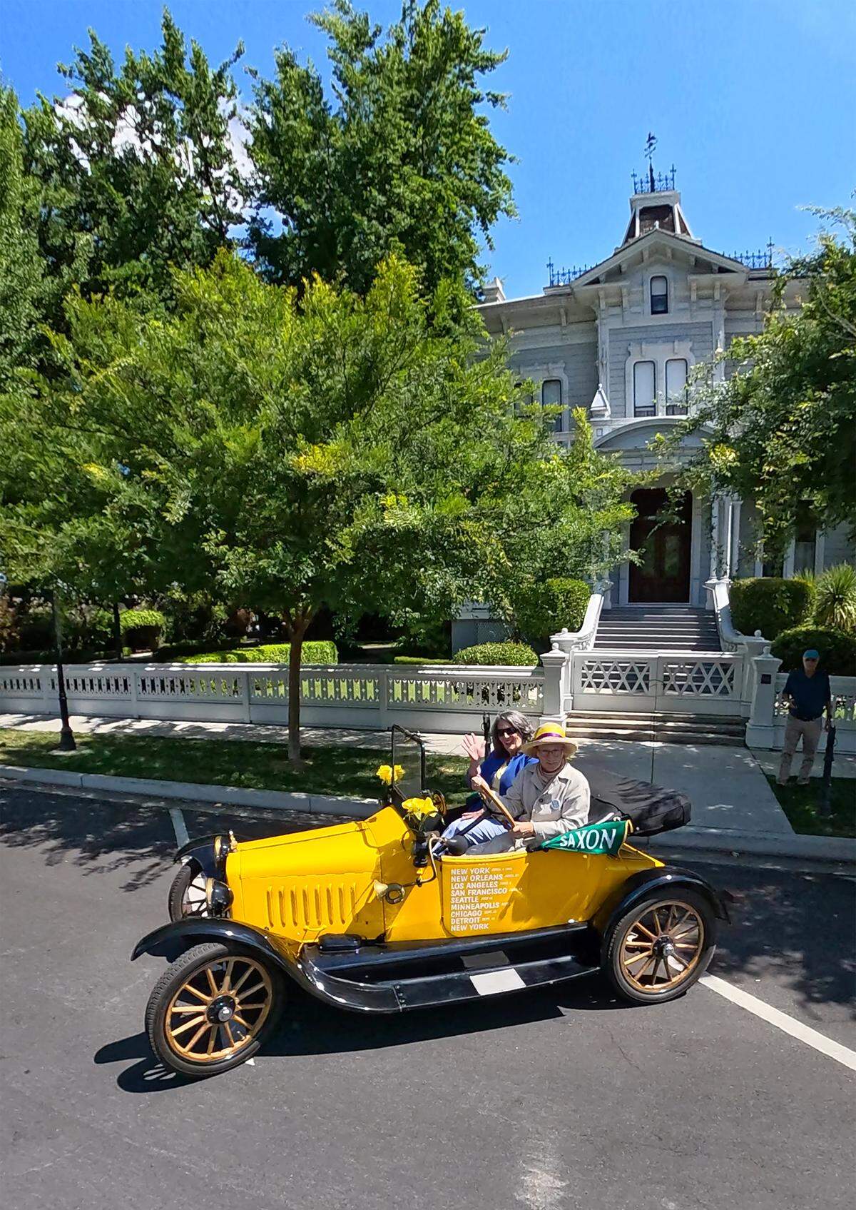 Modesto mayor Sue Zwahlen rides with Susan Nourse in a restored 1918 Saxon motor car similar to the one used in the 1916 suffrage tour. Driving the Vote for Equality Tour visited Modesto, May 6, 2026 and is retracing the route made by suffragettes Nell Richardson and Alice Burke in 1916.
