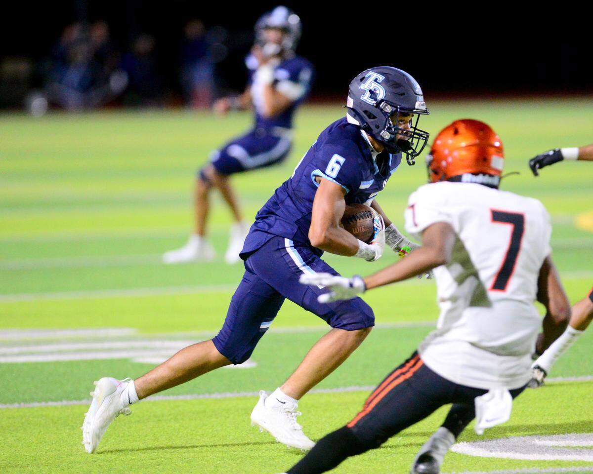 Downey receiver Melo Thurman (6) races up field on his way to score a touchdown during a game between Downey High School and Merced High School at Downey High School in Modesto California on September 1, 2023.