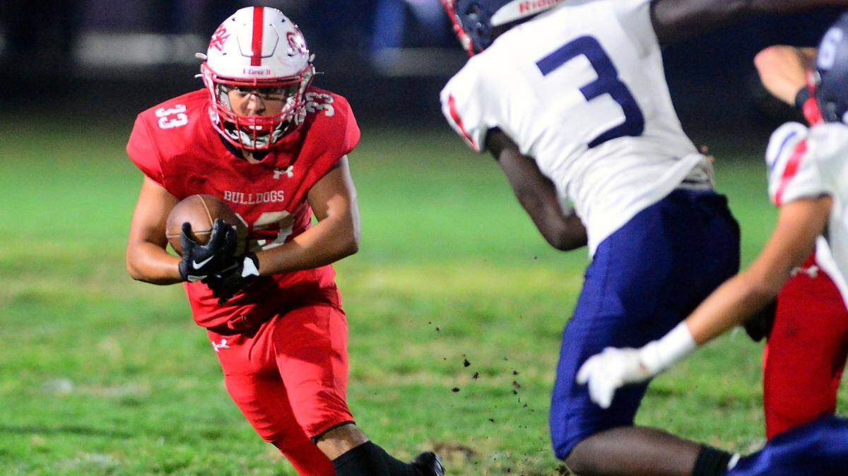 Ceres running back Isaac Vizcarra (33) cuts to the outside during a game between Ceres and Beyer at Ceres High School in Ceres California on September 22, 2023.