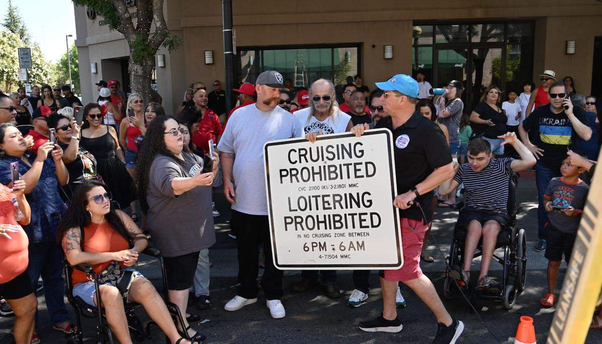 Modesto city staff, in collaboration with the Modesto Police Department and the Modesto Cruiser Council, removed the last “no cruising” sign in downtown Modesto, Calif., Saturday, July 15, 2023. The City Council voted unanimously Tuesday to repeal the 1990 cruising ban, ending it effective immediately.