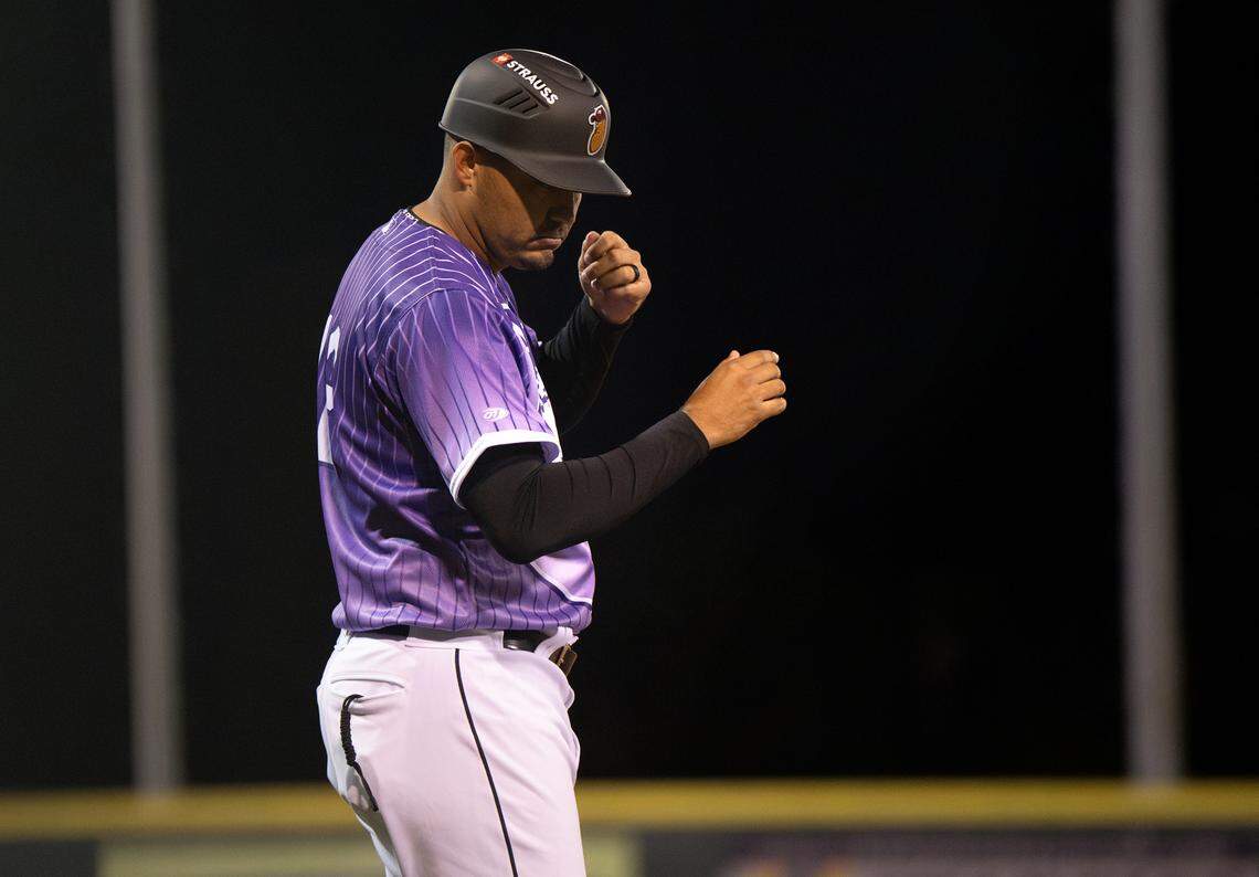 Modesto Nuts manager Luis Caballero throws out signals to a baserunner during the game with San Jose Giants at John Thurman Field in Modesto, Friday, April 4, 2025.