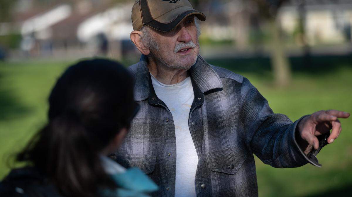 Volunteer Tiffany Ornells talks with David Turner during Stanislaus County’s point-in-time count of the homeless population in Modesto, Calif., Thursday, Jan. 26, 2023.