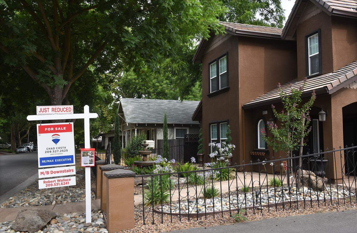 A house with a for sale sign on W Morris avenue near Terminal avenue in Modesto, Calif. is pictured Friday morning on July 13, 2018.