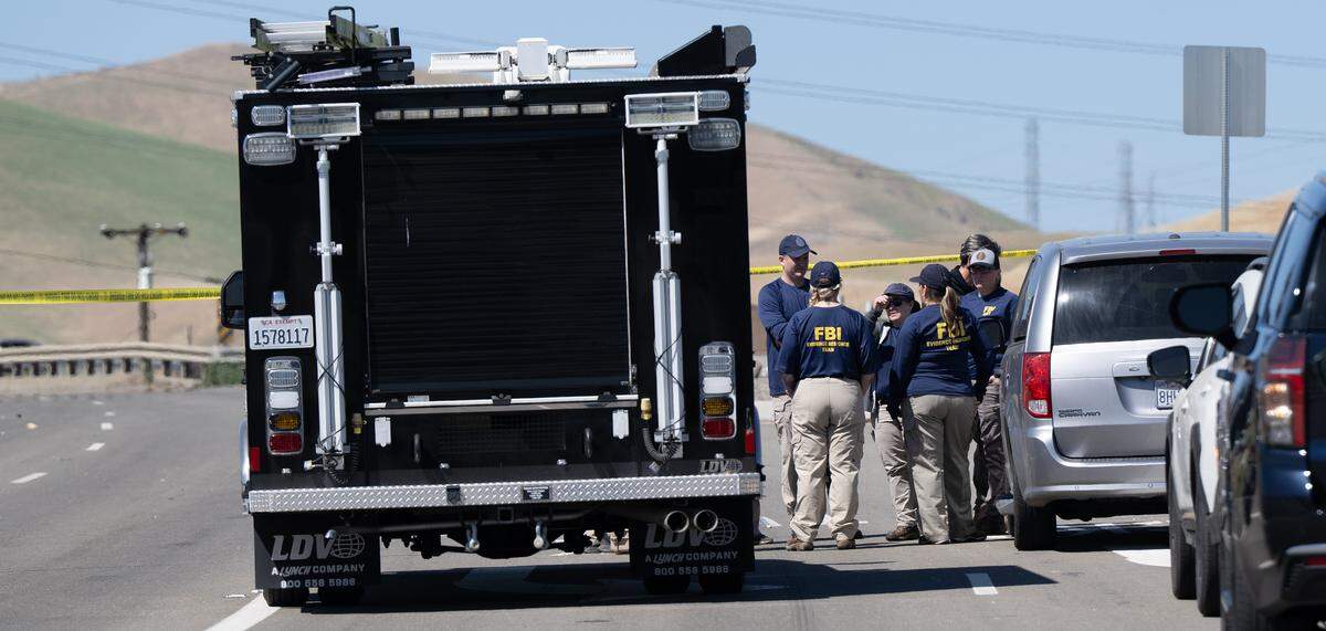 Members of the FBI evidence response team confer on Sperry Avenue in Patterson, Calif., Tuesday, April 7, 2026. Carlos Ivan Mendoza Hernandez, 36, was indicted by a federal grand jury in Sacramento on two counts of assaulting a federal officer and one count of damaging federal property stemming from the traffic stop that day, according to court documents.