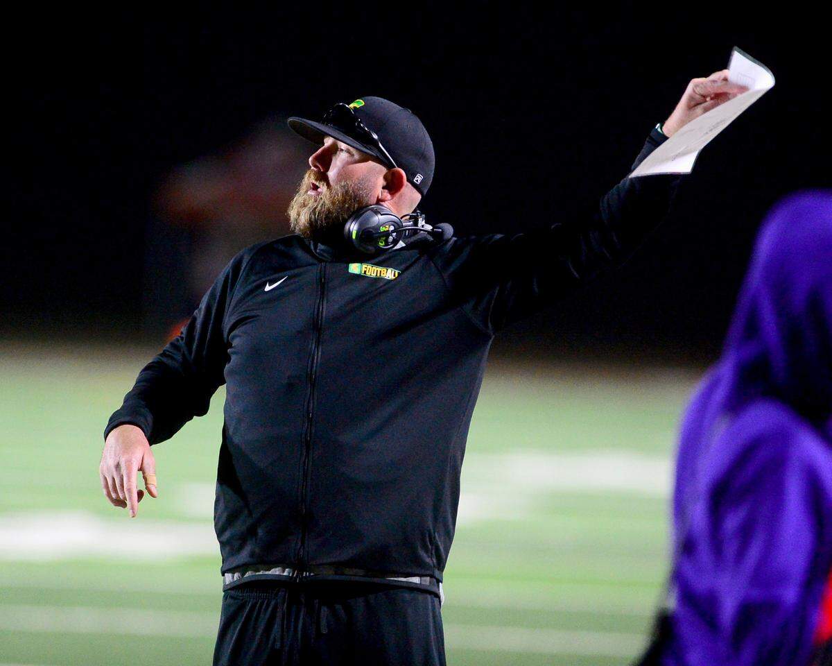 Davis Head Coach Trevor Mew calls to his players from the sidelines during a game between Johansen and Davis at Johansen High School in Modesto California on November 1, 2024.