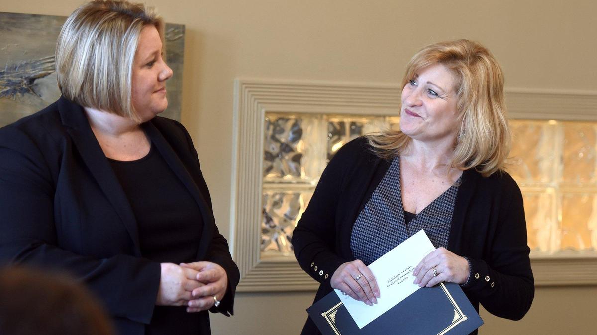 Colleen VanEgmond (left) and Colleen Garcia of Children’s Crisis Center share a light moment during The Modesto Bee’s 2018 Book of Dreams fundraising campaign award ceremony Friday morning January 25, 2019 at the Stanislaus Community Foundation in Modesto, Calif.