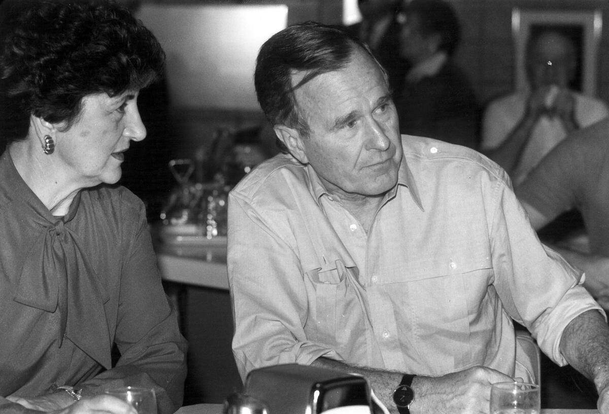 George Bush waits for his chili to arrive at Latif’s in Turlock, Calif. on October 15, 1988. Also pictured is Governor George Deukmejian’s wife Gloria Saatjian at left.