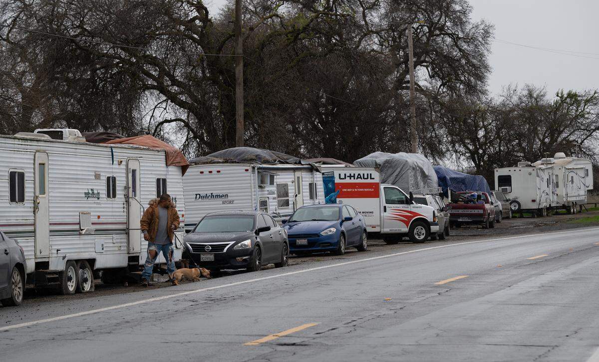 Catfish Camp RV park residents have moved their trailers and RV’s up to Crows Landing Road as the San Joaquin River threatens to flood the park north of Newman, Calif., Wednesday, Jan. 11, 2023.