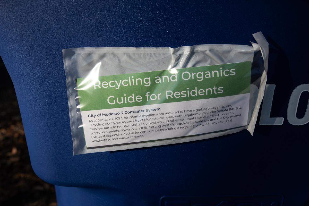 Refuse cans for recyclables were delivered to residents in Modesto, Calif., Friday, Dec. 16, 2022.